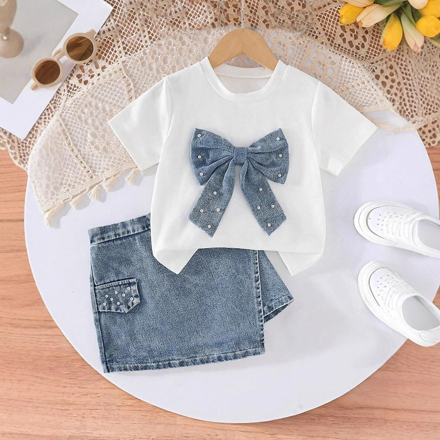 2026 European and American cross-border children's clothing set: girls' bowknot pearl T-shirt + fashionable denim skirt-pants two-piece set