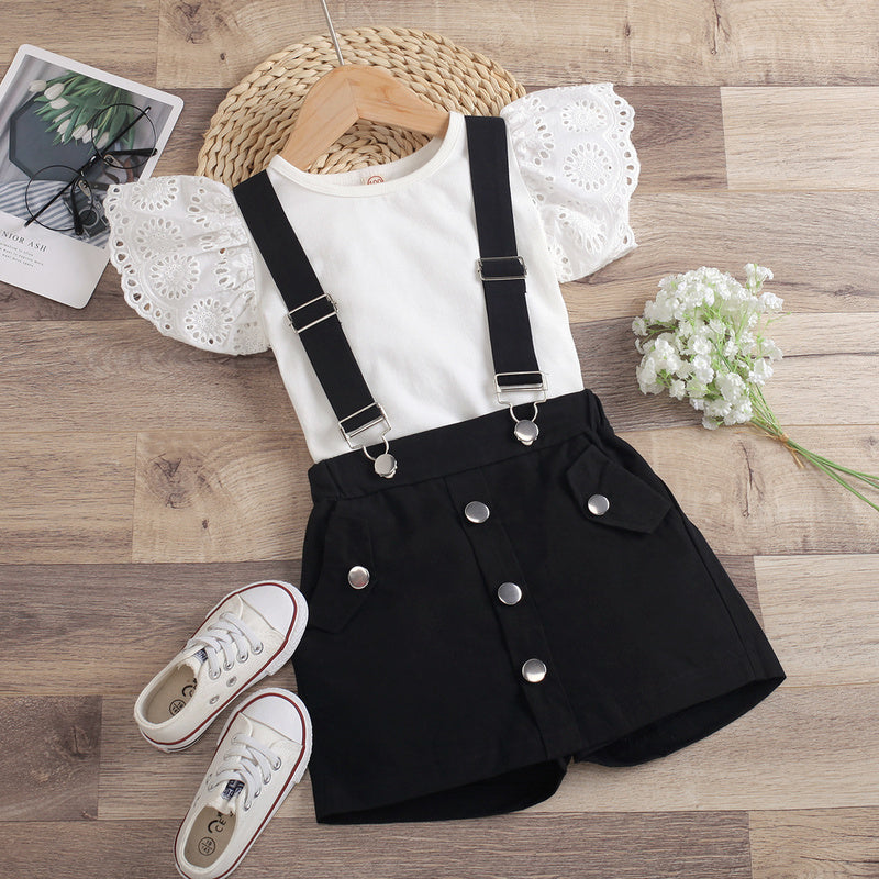 2022 European and American cross-border new children's clothing: solid color hollowed-out fly-sleeve round-neck top with detachable suspender shorts-skirt